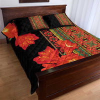Black quilt bed set with red clivia flower pattern and green decorative trim, two pillows