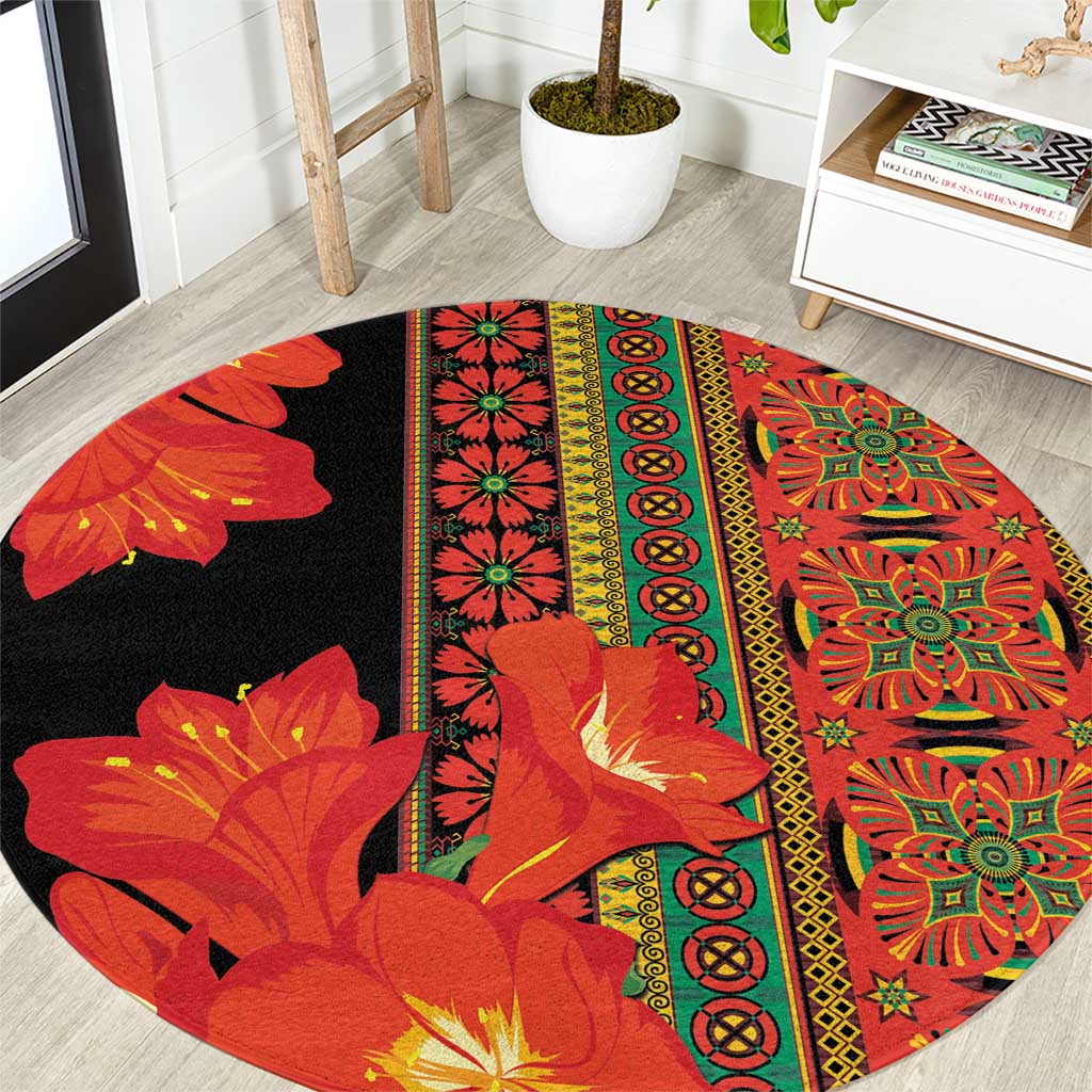Round area rug with black background and red-orange floral medallion strip pattern