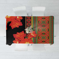 Black tablecloth with red-orange clivia flowers and green patterned border
