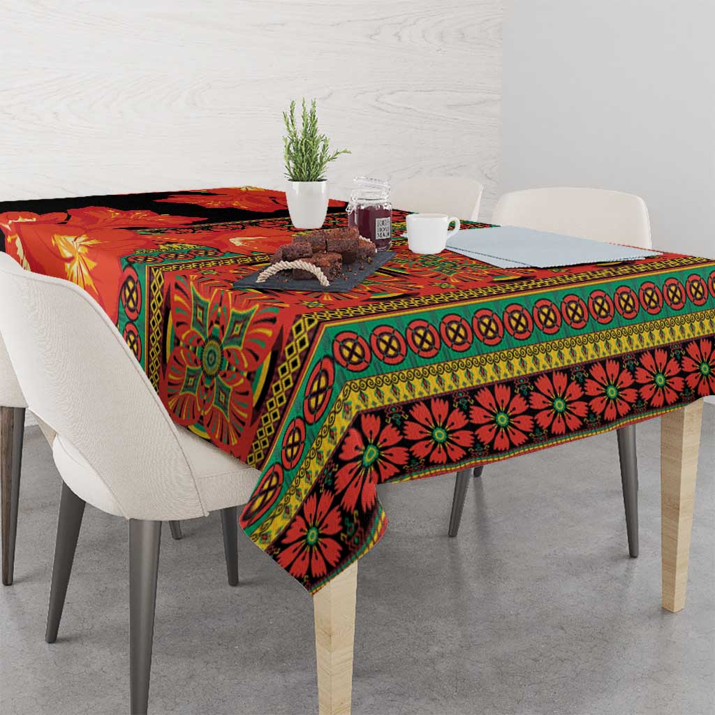 Black-and-red clivia floral tablecloth with green and yellow geometric trim