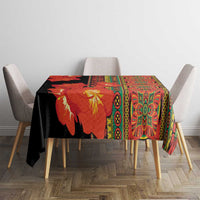 Clivia flower tablecloth with black base, red-orange blooms, and green border
