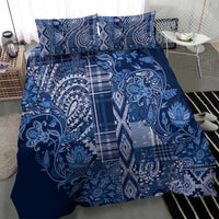 Blue patterned duvet with two pillow shams, paisley floral motif and plaid center panel