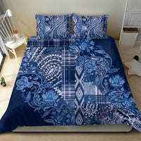 Blue paisley bedding set with two matching pillow shams and full patterned duvet