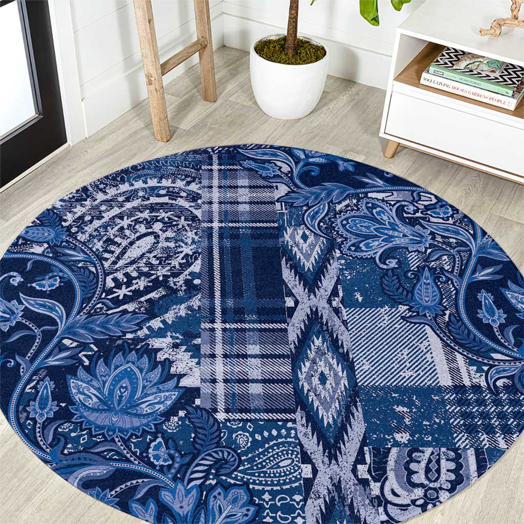 Round blue patterned rug with paisley motifs and plaid sections