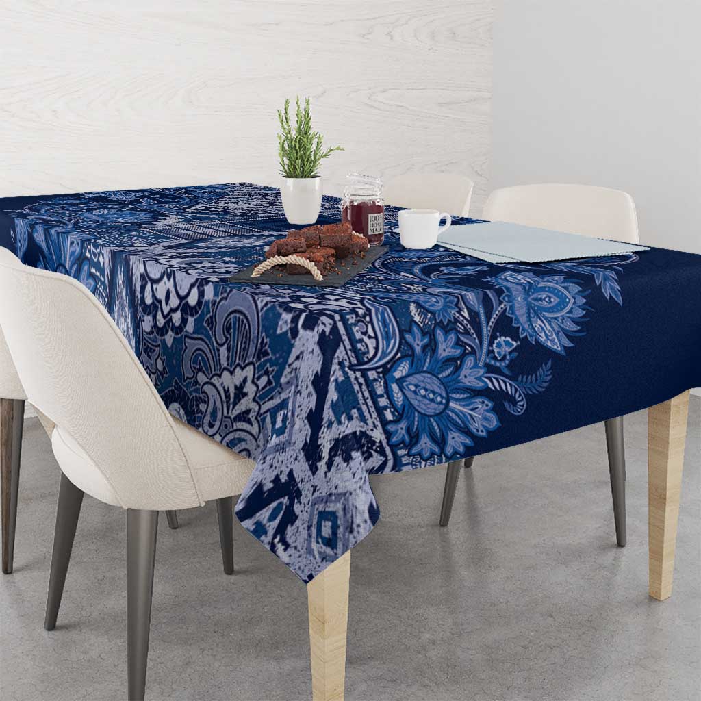 Blue paisley floral tablecloth on dining table with patterned centerpiece panel