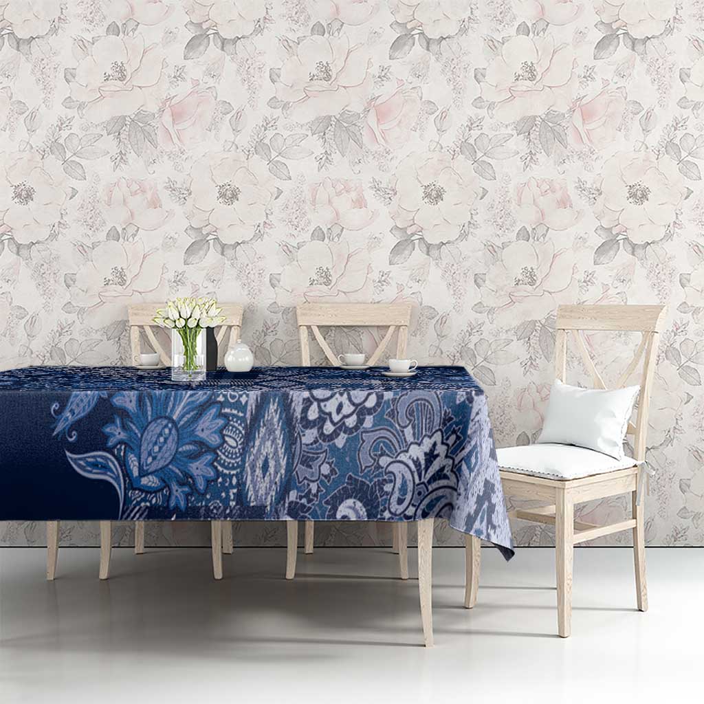 Blue paisley floral tablecloth with large leafy motifs and fine geometric accents