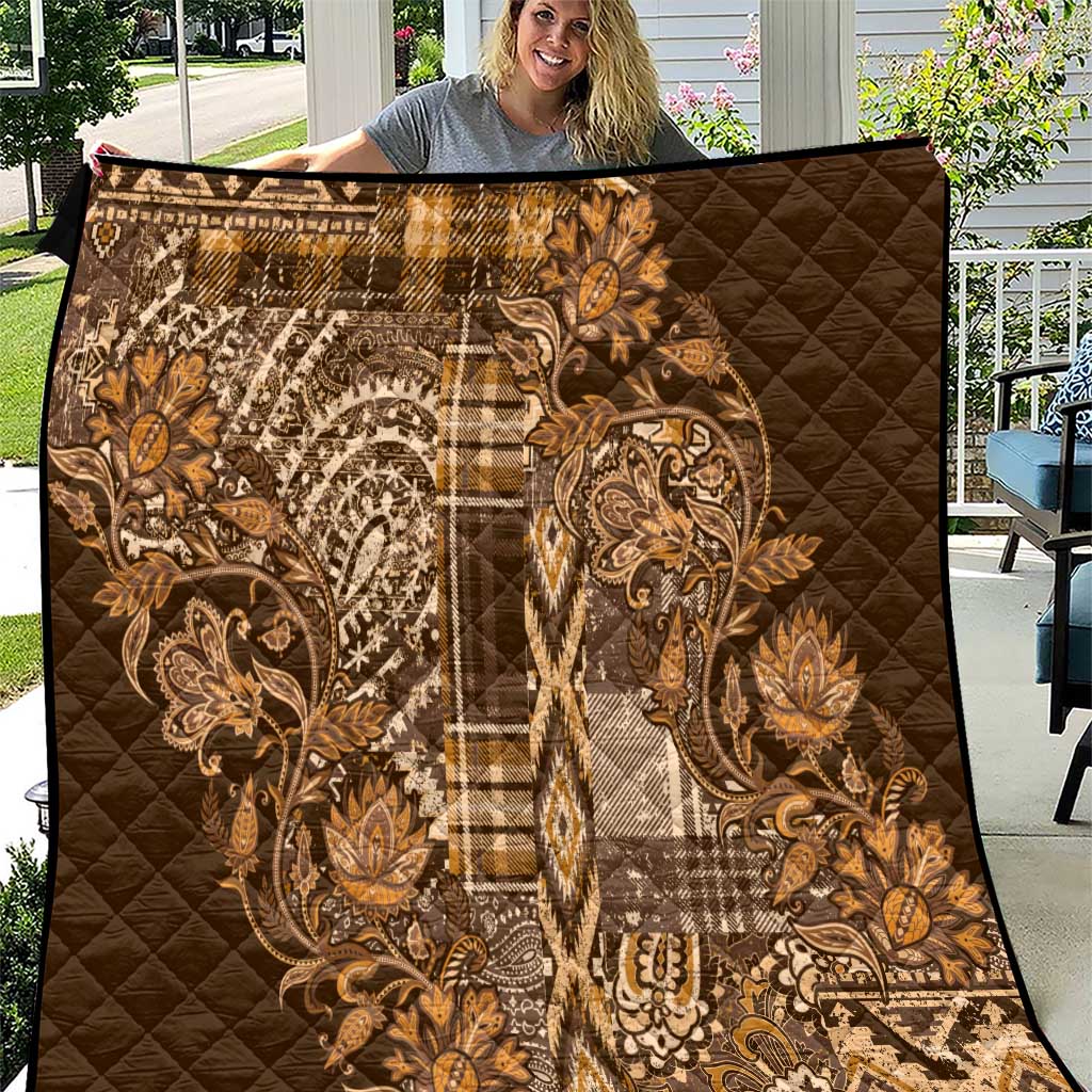 Gold quilted shuka blanket with paisley floral and patchwork plaid pattern