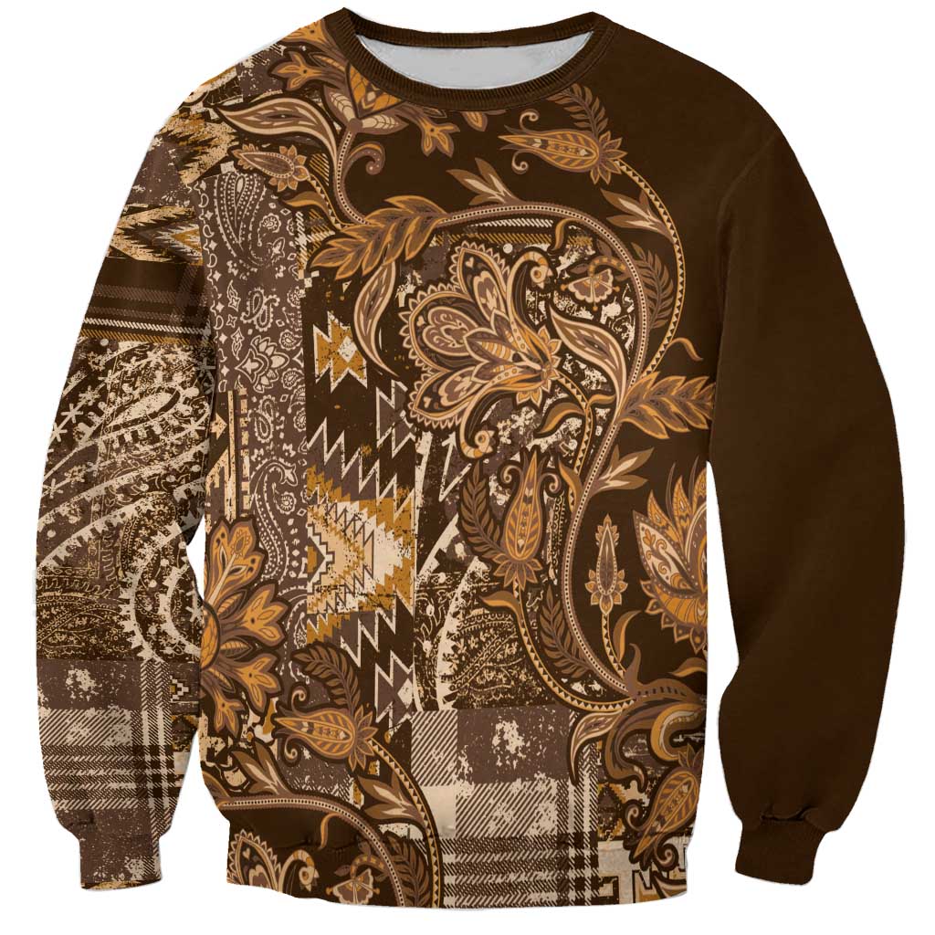 Unisex crewneck sweatshirt in dark brown with gold paisley and plaid patchwork front