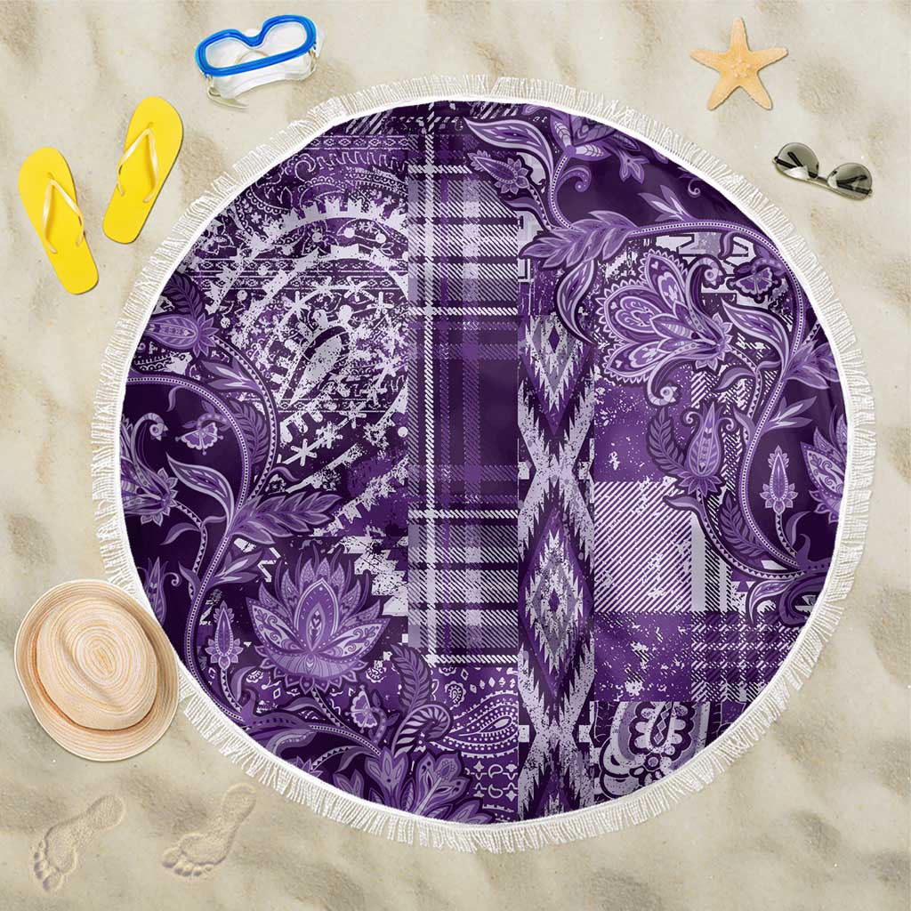 Purple round beach blanket with white fringe and paisley floral patchwork design