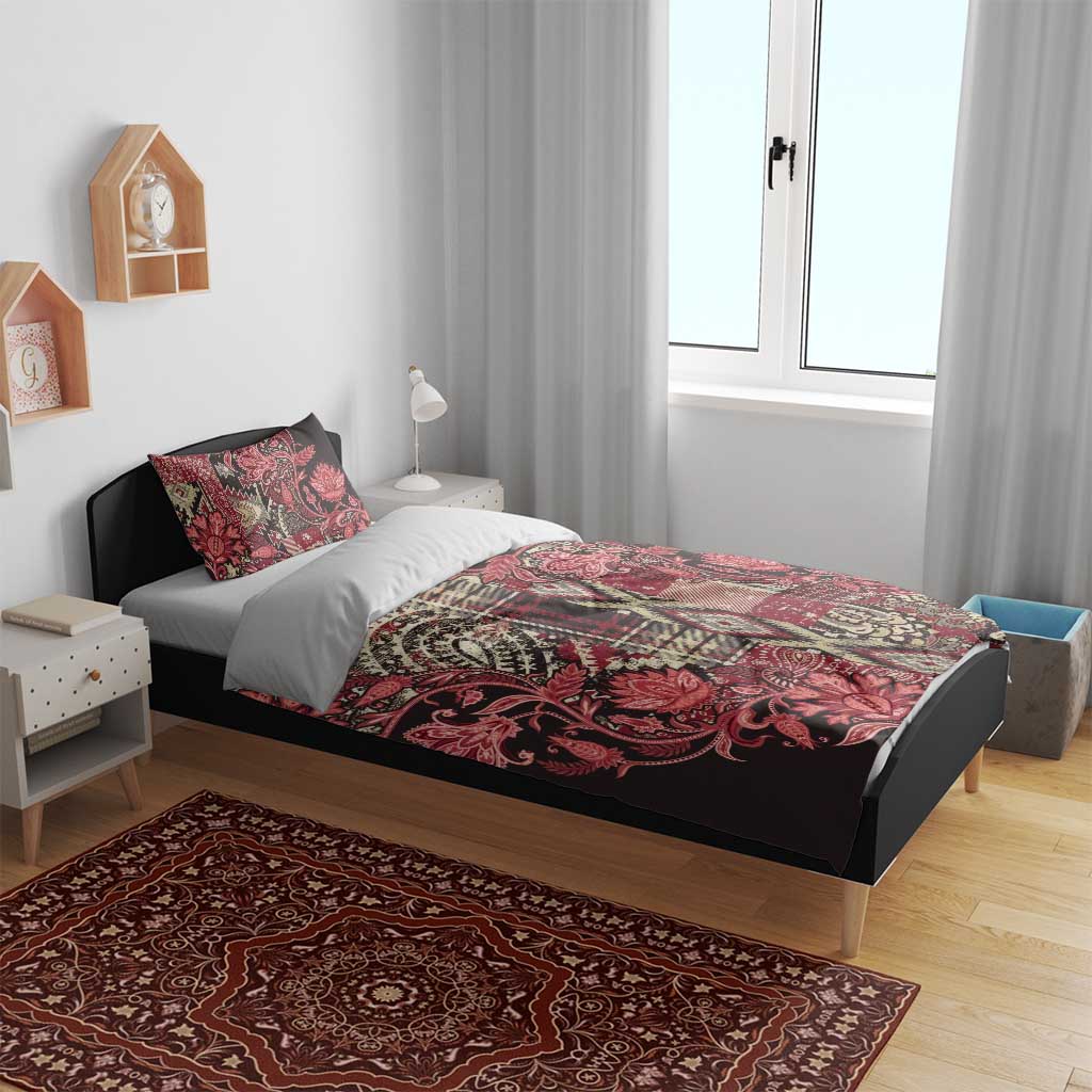 Red floral paisley bedding set featuring a patterned duvet cover and two pillowcases