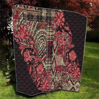 Red and black quilt with paisley floral print and quilted diamond pattern
