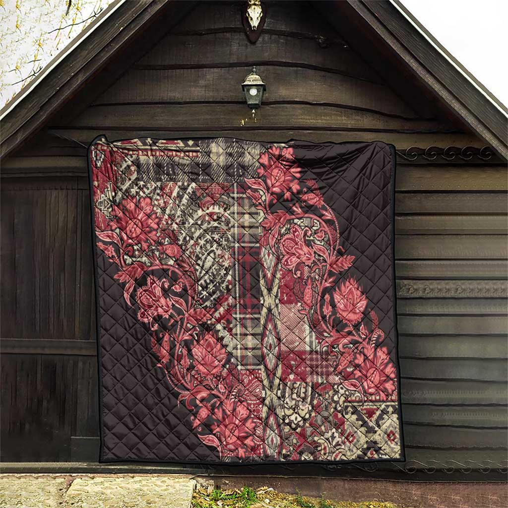 Black outdoor wall-hung quilt with red floral paisley print, diamond-quilted