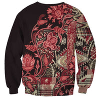 Unisex crewneck sweatshirt with red floral paisley front and dark patchwork sleeves