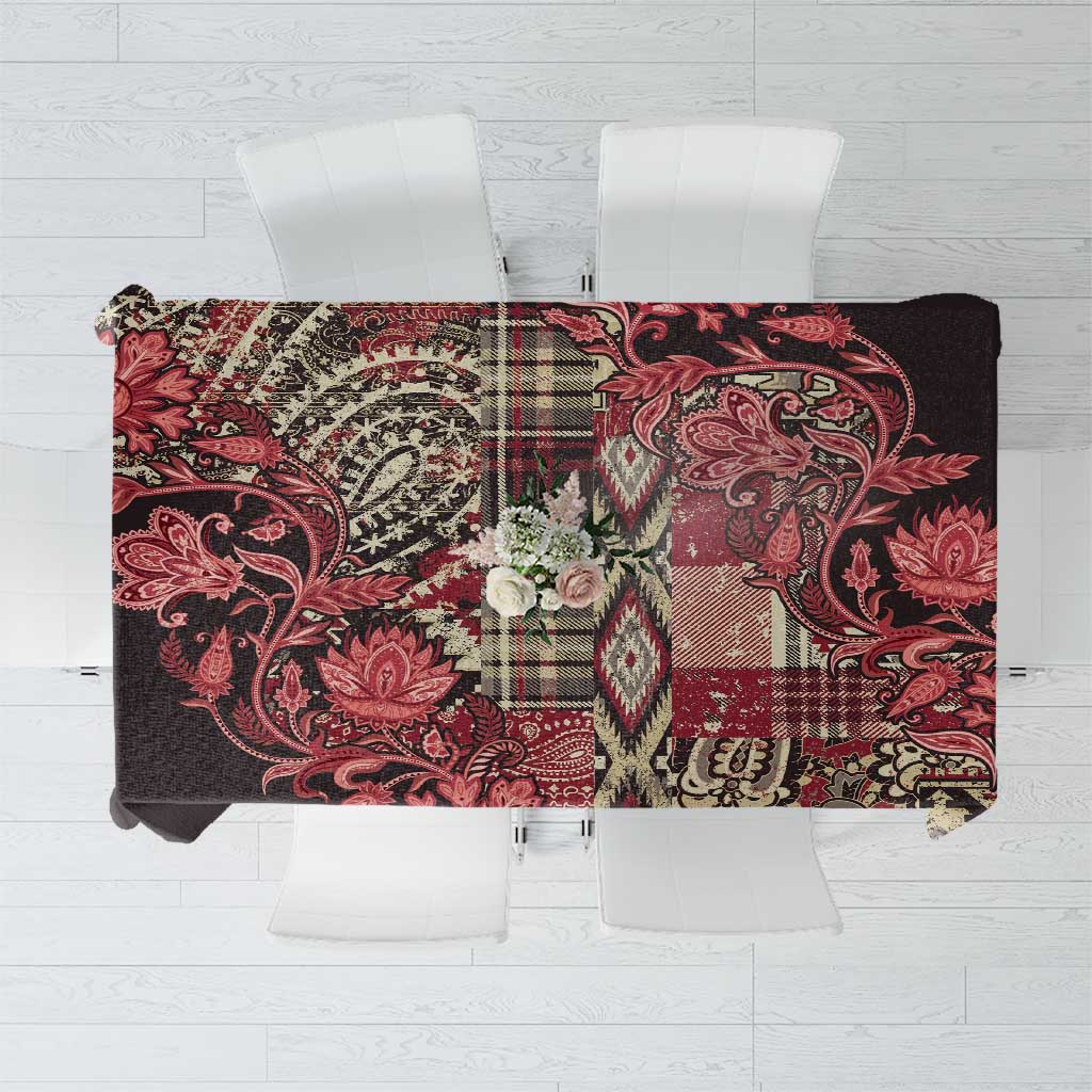 Floral patchwork tablecloth with red, black, and cream patterns, Maasai shuka style.
