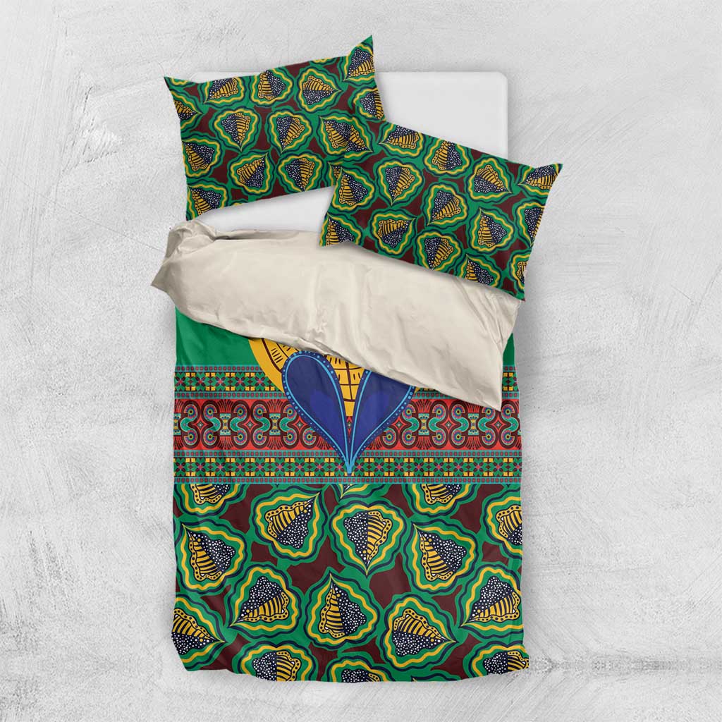 Green kanga-style bedding set with coordinated pillow covers and tribal pattern