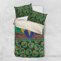 Green kanga-style bedding set with coordinated pillow covers and tribal pattern
