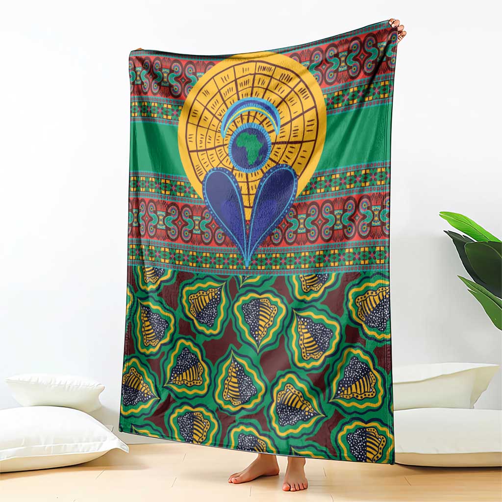 Green African pattern throw blanket featuring a large gold circular emblem with blue shapes