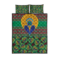 Green kanga-pattern quilt bed set with two matching pillowcases, circular emblem center