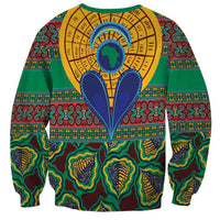 Green kanga-style sweatshirt with central face-and-hearts graphic, long sleeves
