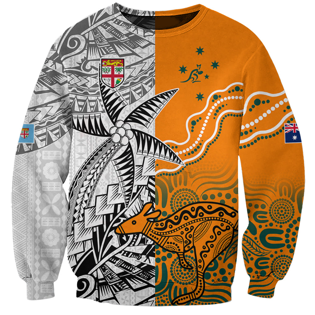 Gold sweatshirt with black-and-white tribal design, orange patterned panel, crew neck, long sleeves