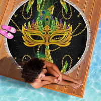 Round fringe beach blanket, top view with gold mask and green feather details on black