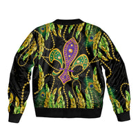 Bomber jacket with black base, green-yellow feather print and fleur-de-lis mask art