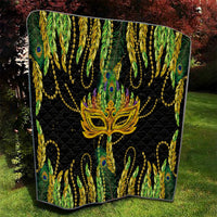Feather mask Mardi Gras quilt with angled edges, black background and gold mask over peacock feathers