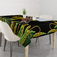 Green and black peacock feather tablecloth with gold bead trim over table