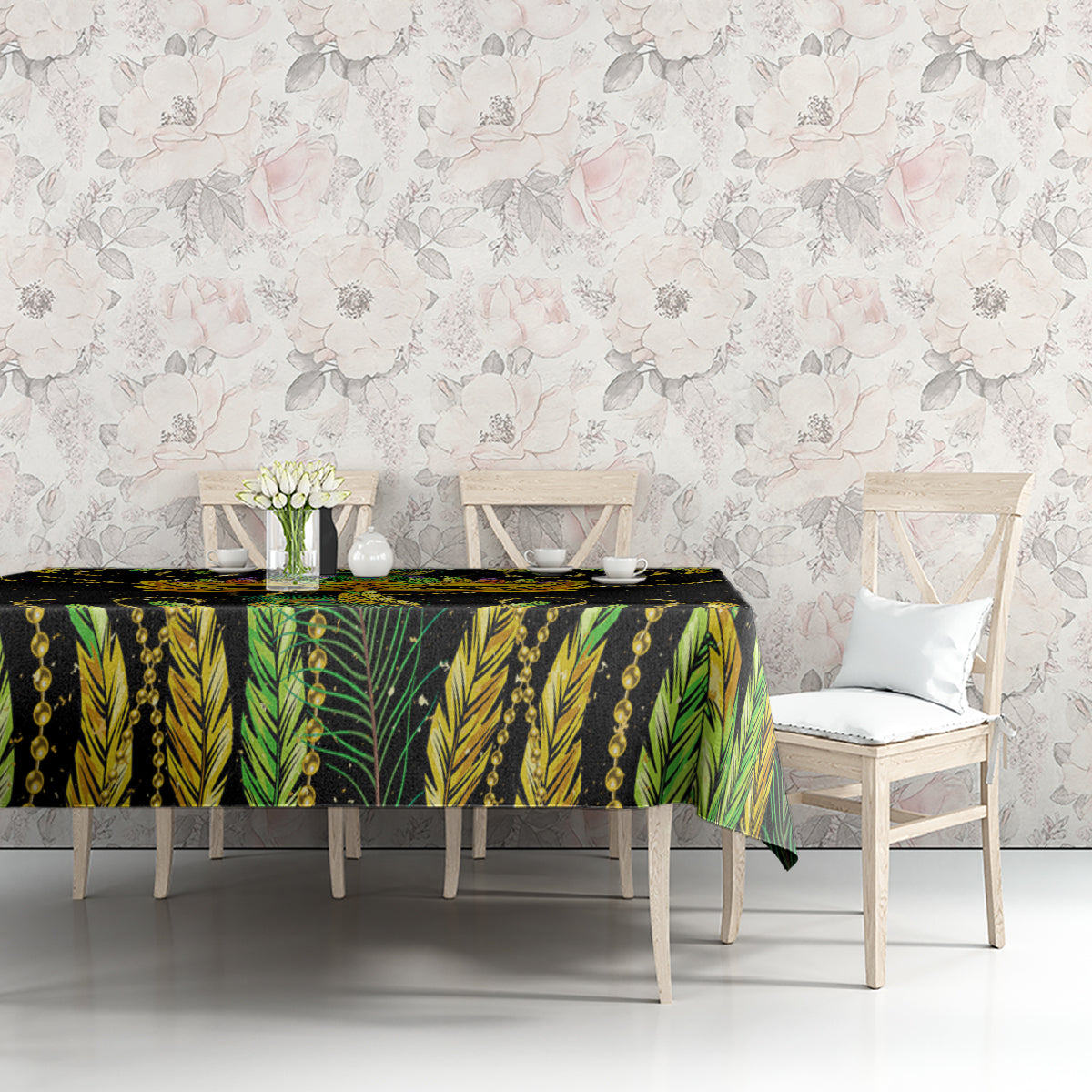 Green and black feather-pattern tablecloth with beaded chain motif along table