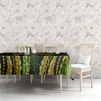 Green and black feather-pattern tablecloth with beaded chain motif along table