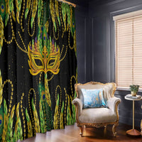 Feather-pattern window curtains in green, gold, and black with a central masquerade mask.