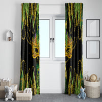 Two green and gold feather-pattern curtain panels with black background and ornate mask emblem.