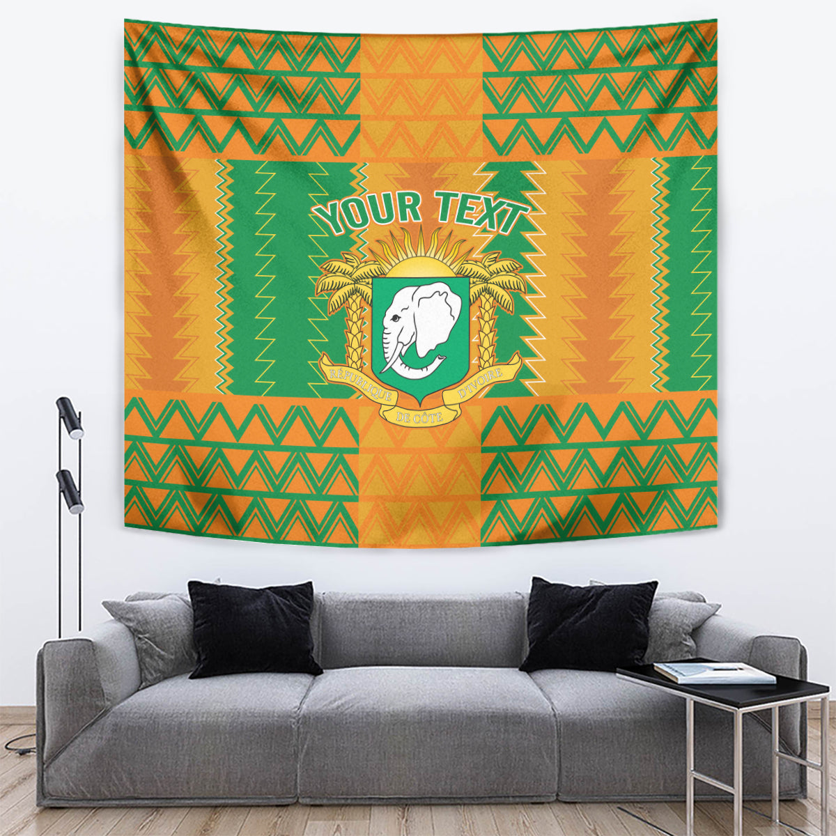 Rectangular tapestry wall hanging with orange-green zigzag pattern, elephant crest, and 'Your Text'
