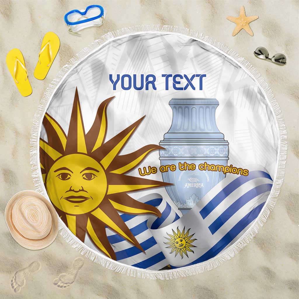 Round white beach blanket with fringe, Uruguay sun and trophy with 'We are the champions'