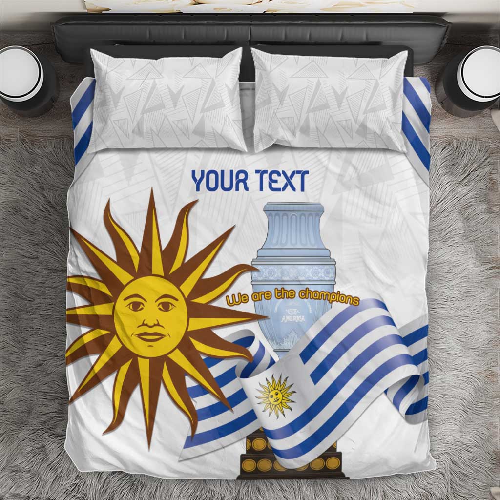 White bedding set with blue striped flag design and sun face; two matching pillow shams