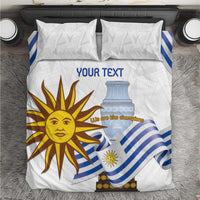 White bedding set with blue striped flag design and sun face; two matching pillow shams