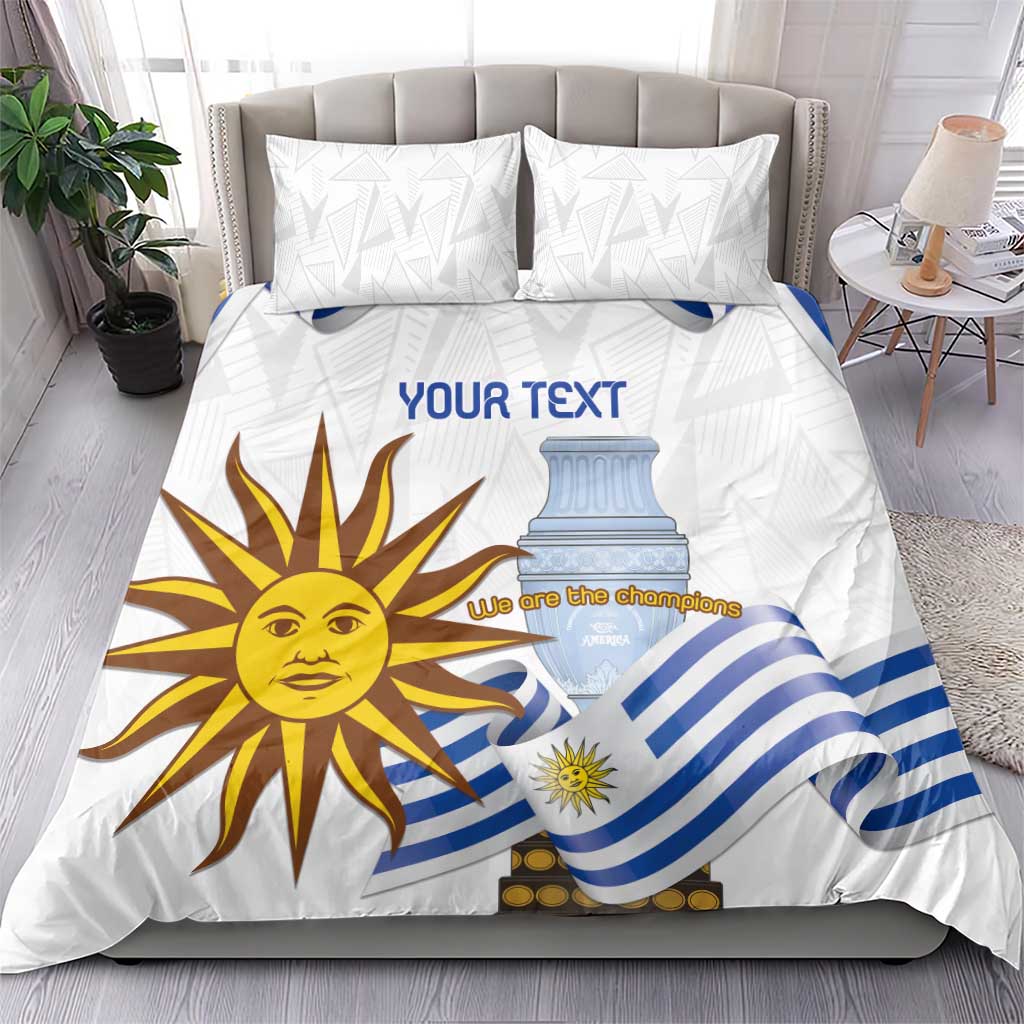 White bedding set on bed with two pillow shams; blue-striped flag and sun face graphic