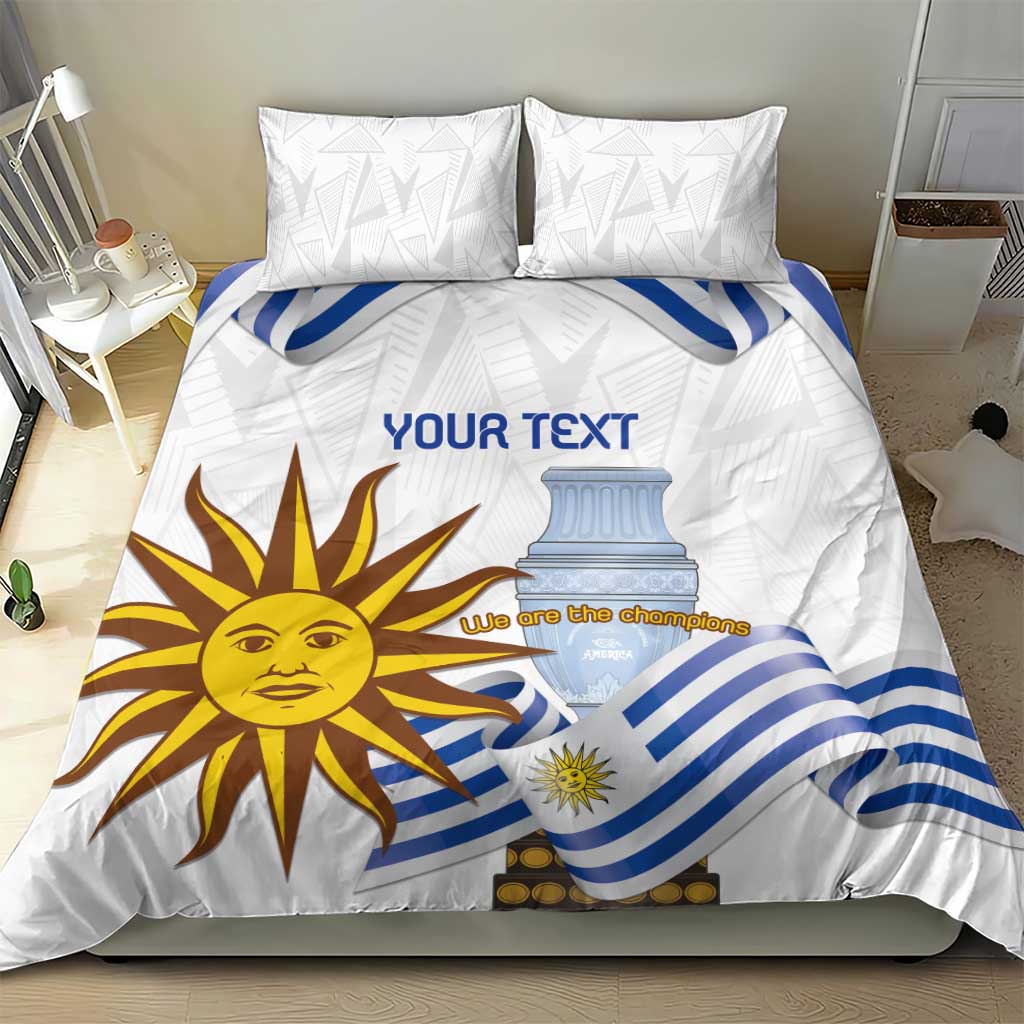 White bedding set with blue striped flag motif and sun face, shown with two pillow shams