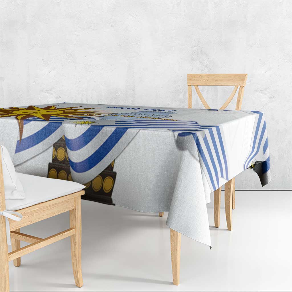 Blue-and-white striped football tablecloth draped over a wooden dining table