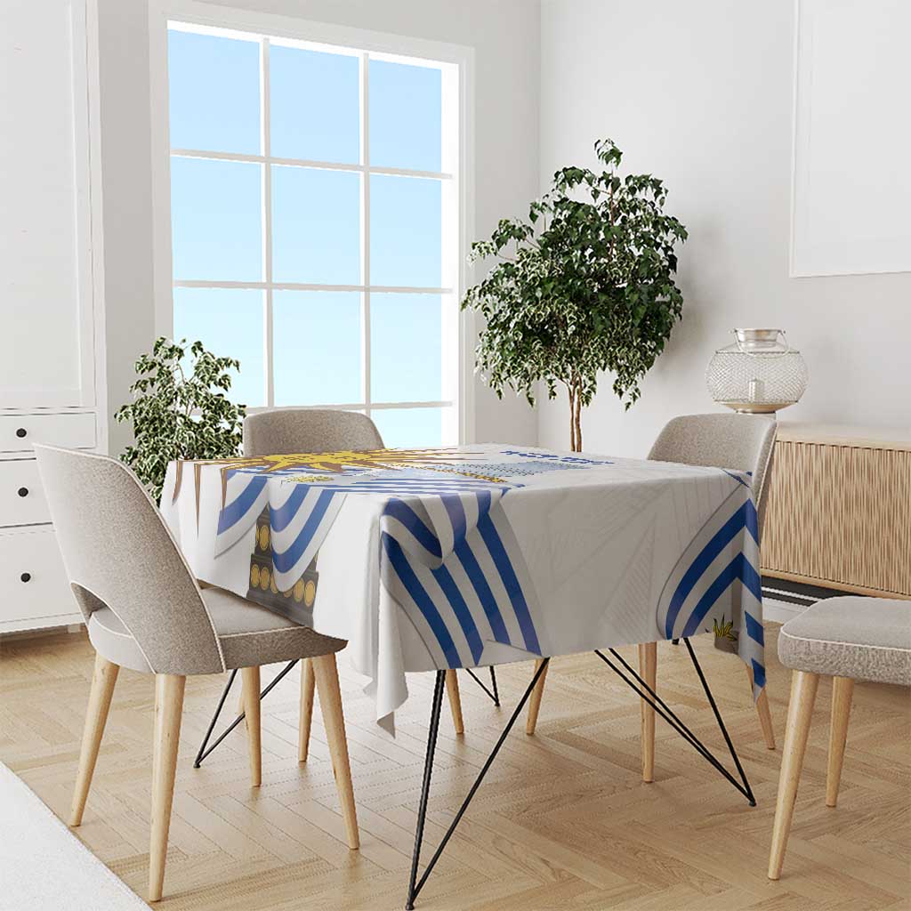 Blue-and-white striped football tablecloth on a dining table with chairs