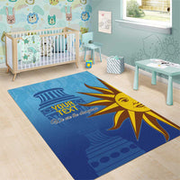 Blue football area rug with yellow sun face graphic and “YOUR TEXT” customization