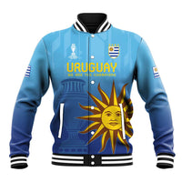 Blue baseball jacket with snap buttons, ribbed trim, Uruguay crest and sun graphic