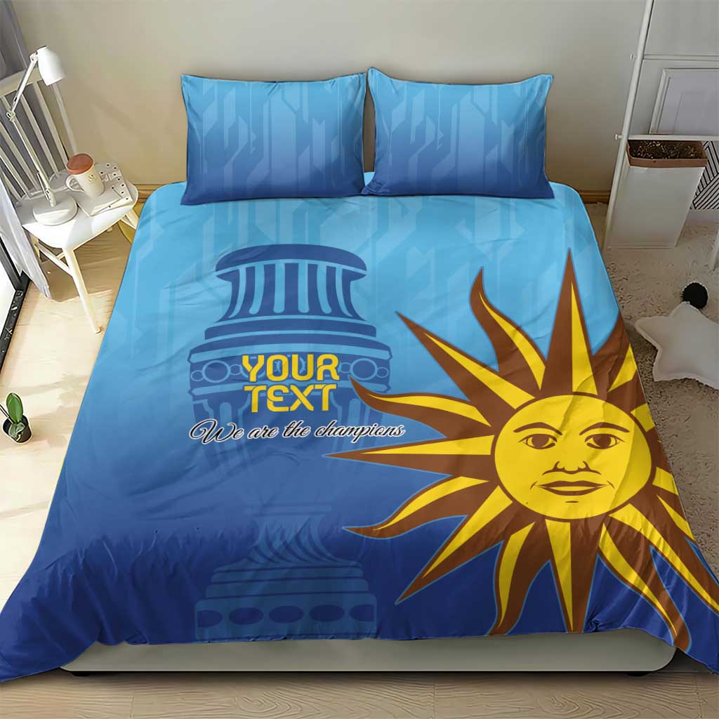 Blue duvet and pillow set featuring yellow sun-face graphic and 'We are the champions'