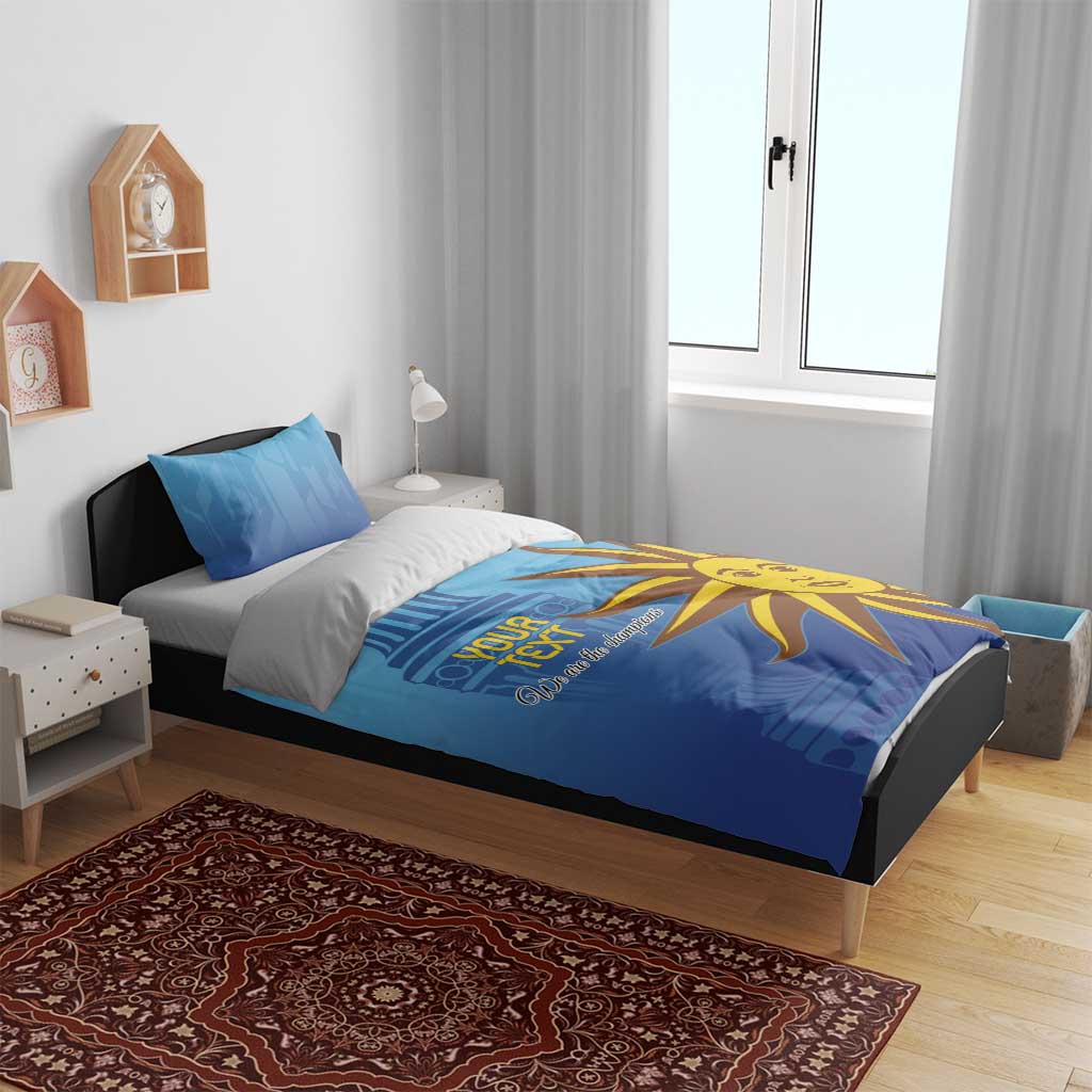 Blue bedding set on bed with yellow sun mascot graphic and 'Your Text' on the duvet