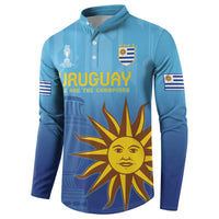 Blue football button sweatshirt featuring Uruguay text and yellow sun face graphic