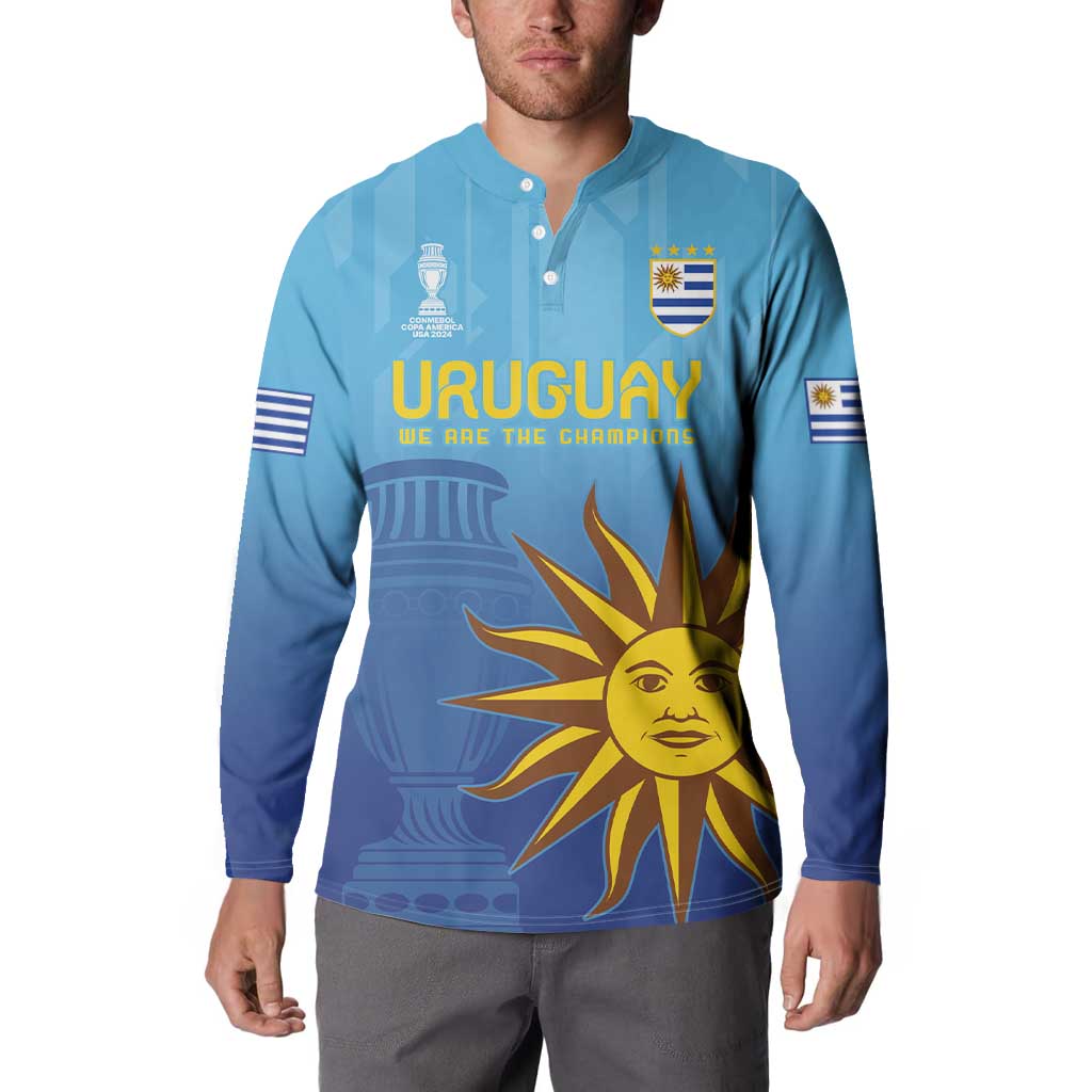 Blue football button sweatshirt with Uruguay crest and large yellow sun graphic