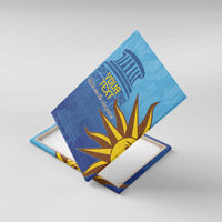Blue canvas wall art with custom text and sunburst design, shown at an angle
