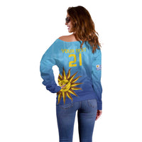 Women’s off-shoulder blue football sweater, back print with number 21 and sun emblem