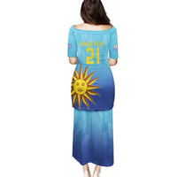 Blue football dress with back text and number 21, sun emblem and crest badges