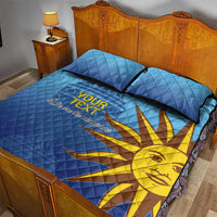 Blue football quilt bed set with two pillows, yellow sun graphic and dark trim